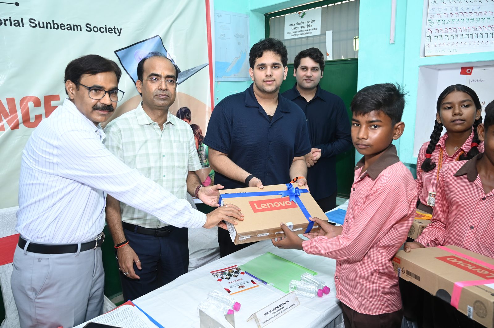 Children receiving learning kits